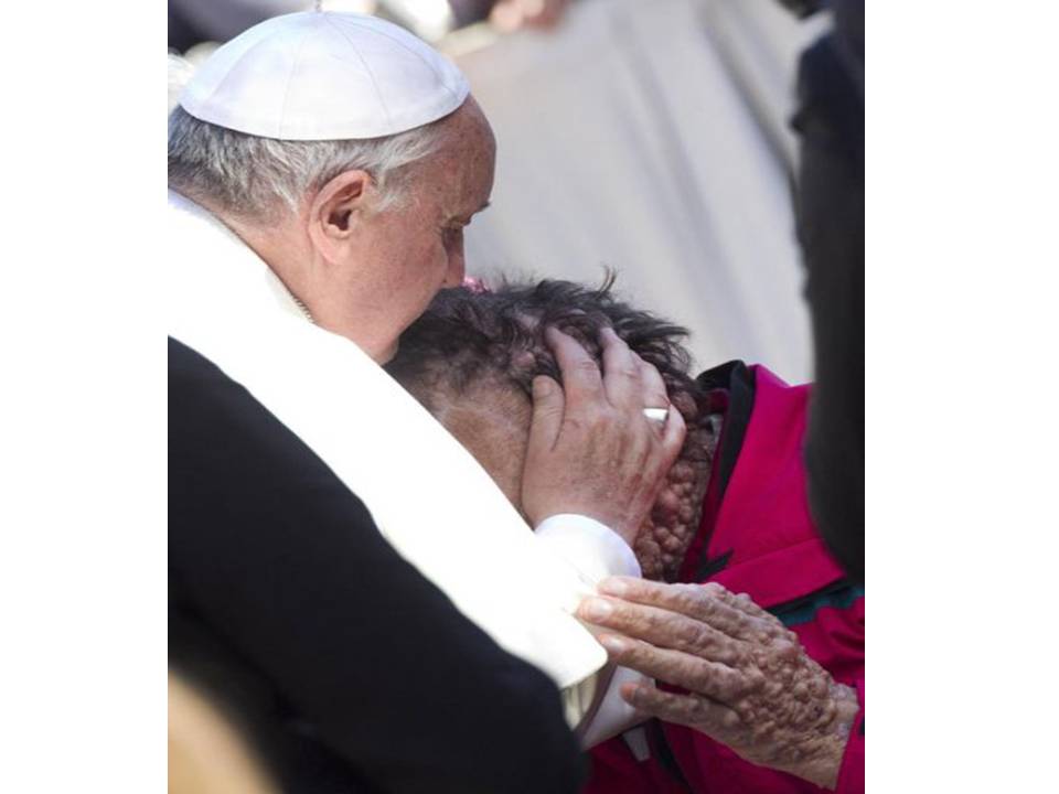 Pope Francis kissing disfigured man